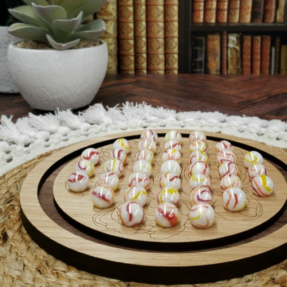 oak peony solitaire heirloom wooden marble solitaire game with red and yellow swirl marbles